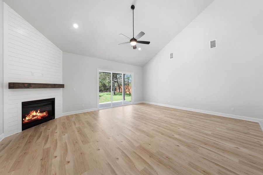Spacious, open floorplan with a beautiful fireplace in the liviing room.