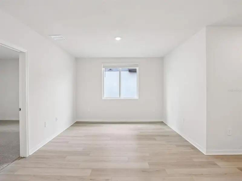 Spacious, unfurnished interior of a new home in The Grove at Stuart Crossing - Classic Series, Bartow (Image 15).