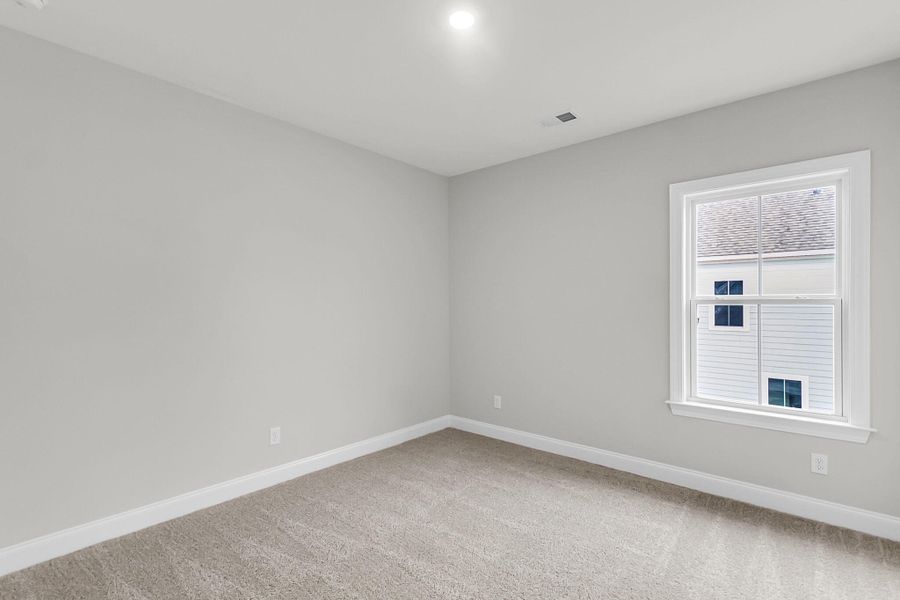 Spacious, unfurnished interior of a new home in Tidewater at Lakes of Cane Bay, Summerville (Image 35).