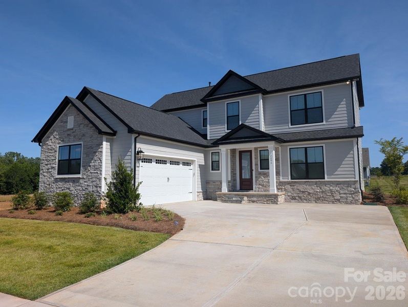 Front exterior of a new home in Stoneridge Hills, Rock Hill, SC, highlighting curb appeal (Image 1). Front exterior of a new home in Stoneridge Hills, Rock Hill, SC, highlighting curb appeal (Image 1).