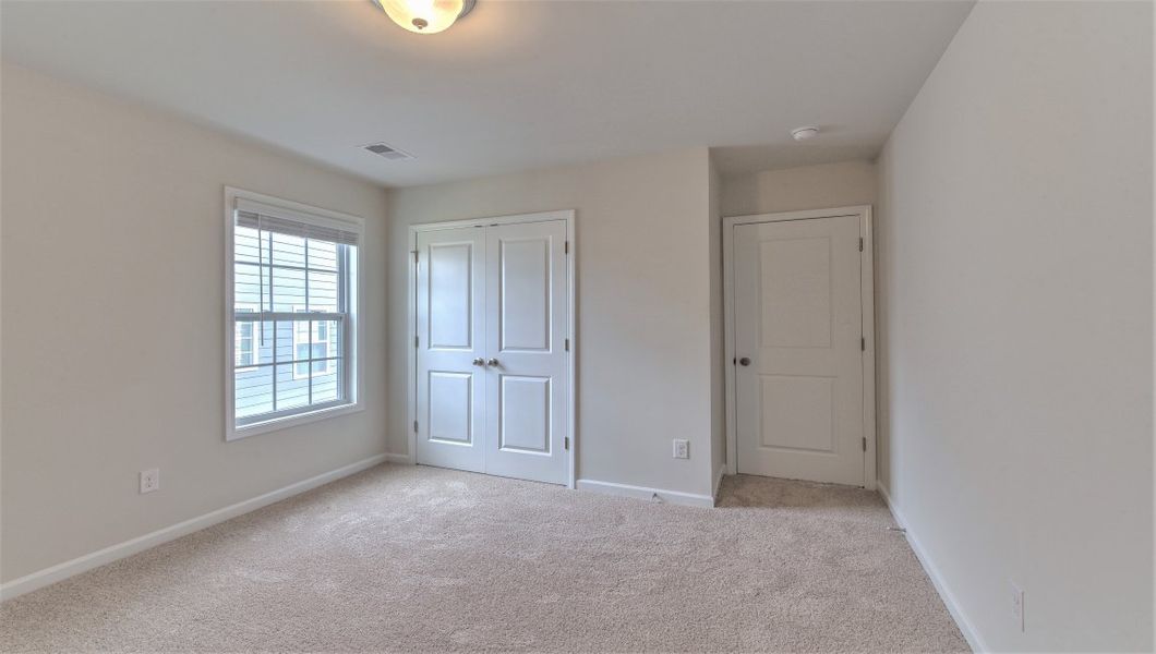 Spacious, unfurnished interior of a new home in Reserve at Tap Root Farms, Fletcher (Image 29). Spacious, unfurnished interior of a new home in Reserve at Tap Root Farms, Fletcher (Image 29).