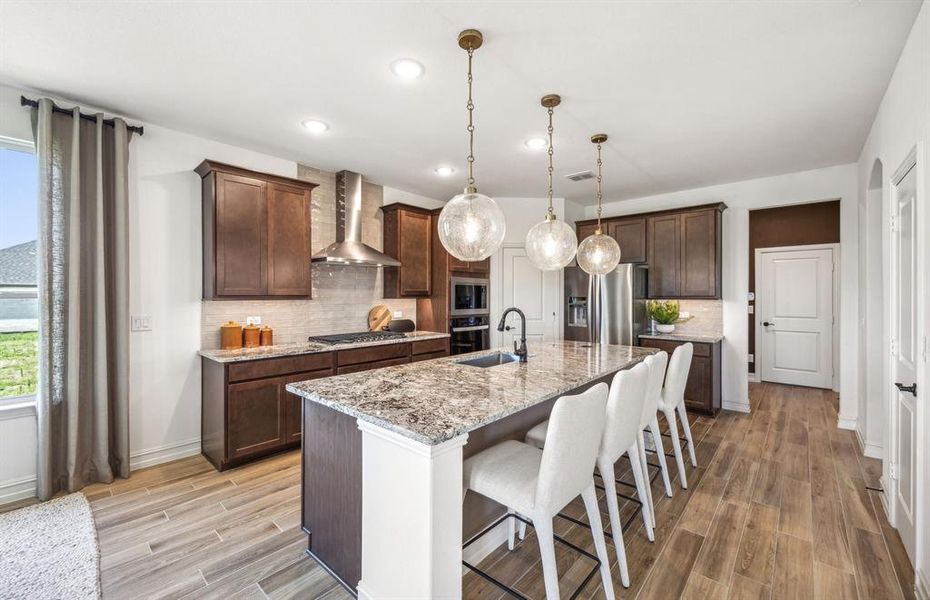 *actual home, furniture not included - Spacious kitchen with eat-in bartop island