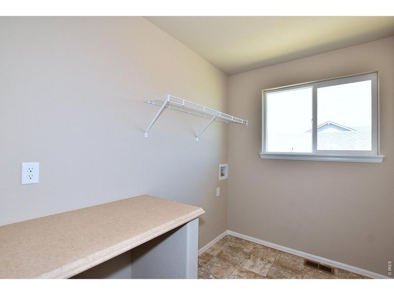 Spacious, unfurnished interior of a new home in Union Colony West, Greeley (Image 30).