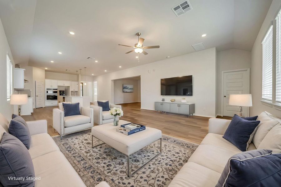 Virtually Staged Family Room open to the Kitchen and Dining room