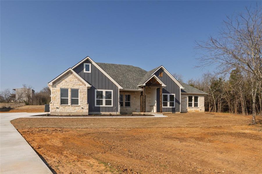 Front exterior of a new home in , Cleburne, TX, highlighting curb appeal (Image 20).