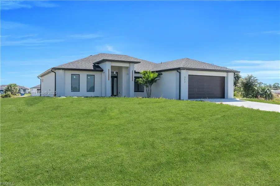 Front exterior of a new home in , Lehigh Acres, FL, highlighting curb appeal (Image 1). Front exterior of a new home in , Lehigh Acres, FL, highlighting curb appeal (Image 1).