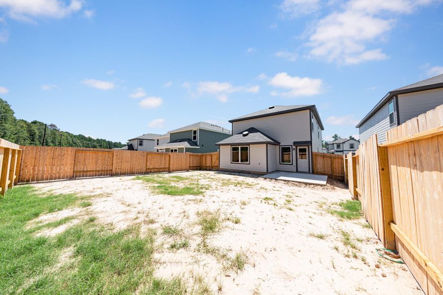 Exterior details and patio area of a home in Townsend Reserve, Splendora (Image 3).