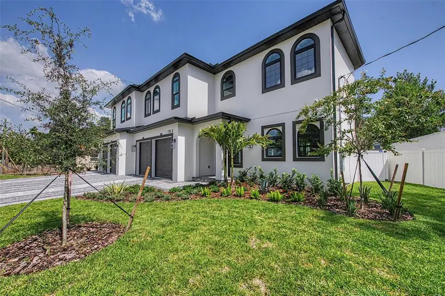 Front exterior of a new home in , Tampa, FL, highlighting curb appeal (Image 1). Front exterior of a new home in , Tampa, FL, highlighting curb appeal (Image 1).