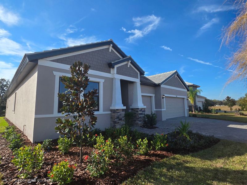Front exterior of a new home in River Preserve Estates, Parrish, FL, highlighting curb appeal (Image 1). Front exterior of a new home in River Preserve Estates, Parrish, FL, highlighting curb appeal (Image 1).