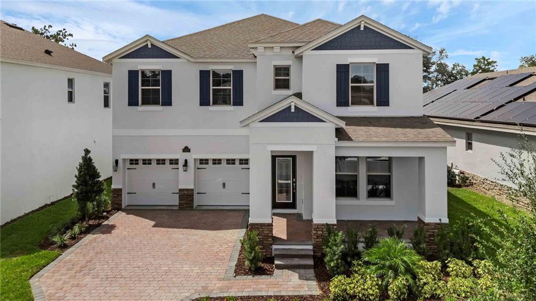 Front exterior of a new home in Waterleigh, Winter Garden, FL, highlighting curb appeal (Image 1). Front exterior of a new home in Waterleigh, Winter Garden, FL, highlighting curb appeal (Image 1).