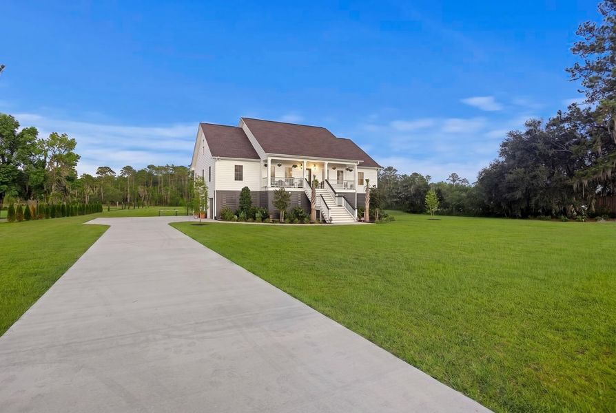 Front exterior of a new home in , Meggett, SC, highlighting curb appeal (Image 1). Front exterior of a new home in , Meggett, SC, highlighting curb appeal (Image 1).