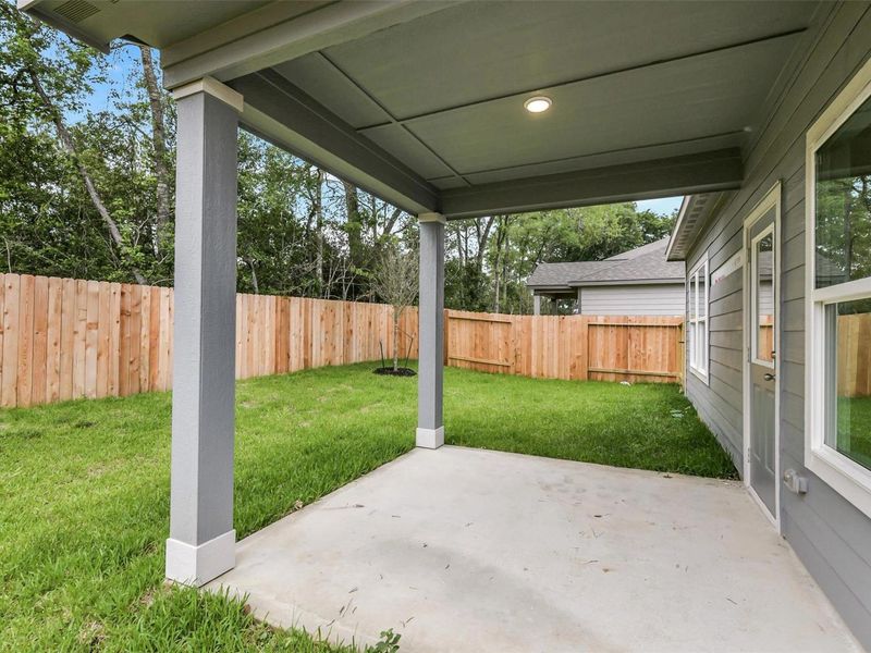 Exterior details and patio area of a home in Caney Creek Place, Conroe (Image 2). Exterior details and patio area of a home in Caney Creek Place, Conroe (Image 2).