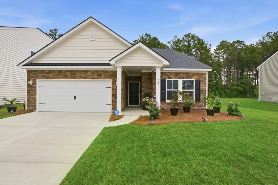 Front exterior of a new home in , Moncks Corner, SC, highlighting curb appeal (Image 2). Front exterior of a new home in , Moncks Corner, SC, highlighting curb appeal (Image 2).