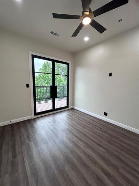 Upstairs bedroom on 2nd floor with balcony access.