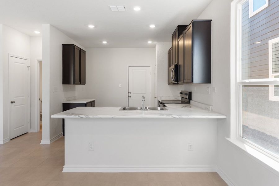 Furnished interior view inside a new home in Spanish Trails Villas, San Antonio (Image 5).
