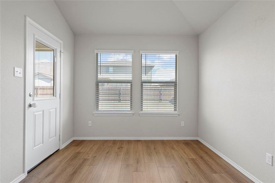 Entryway featuring plenty of natural light and light wood-type flooring Entryway featuring plenty of natural light and light wood-type flooring