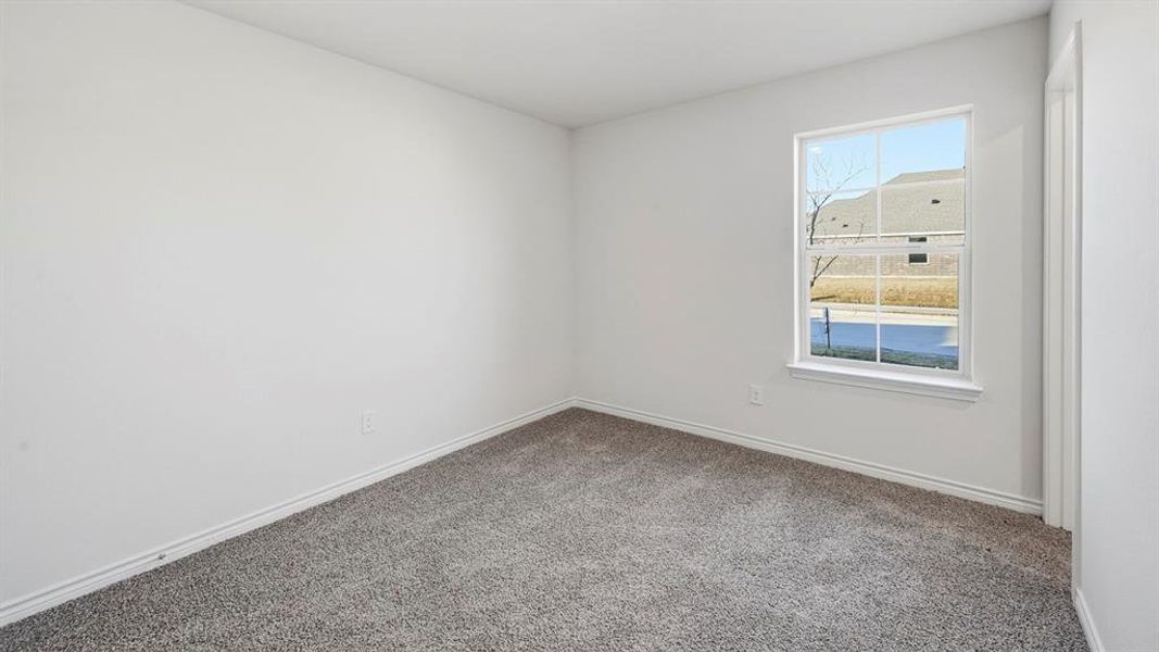 Room featuring light gray carpet flooring and white walls
