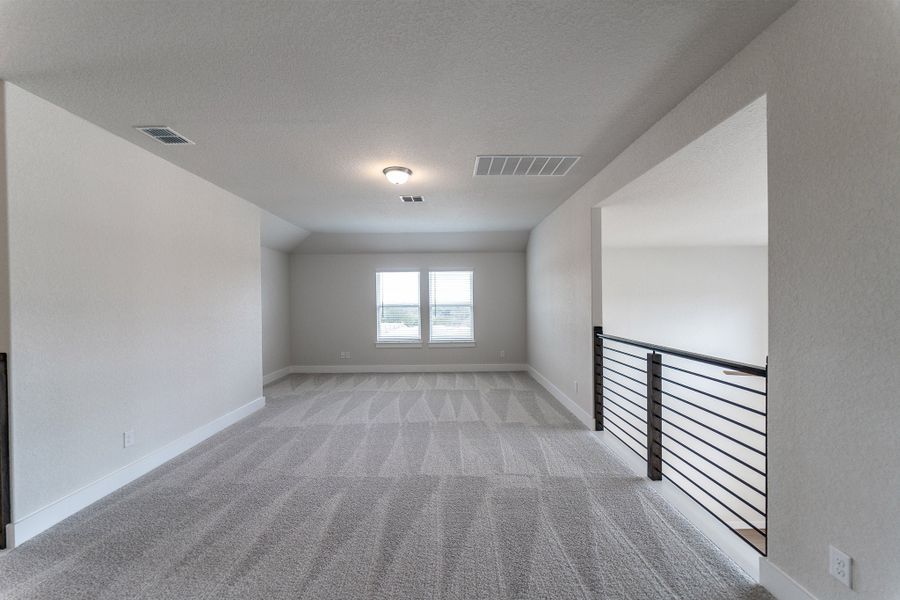 Spacious, unfurnished interior of a new home in The Woodlands at Medina Hills, Mico (Image 20).