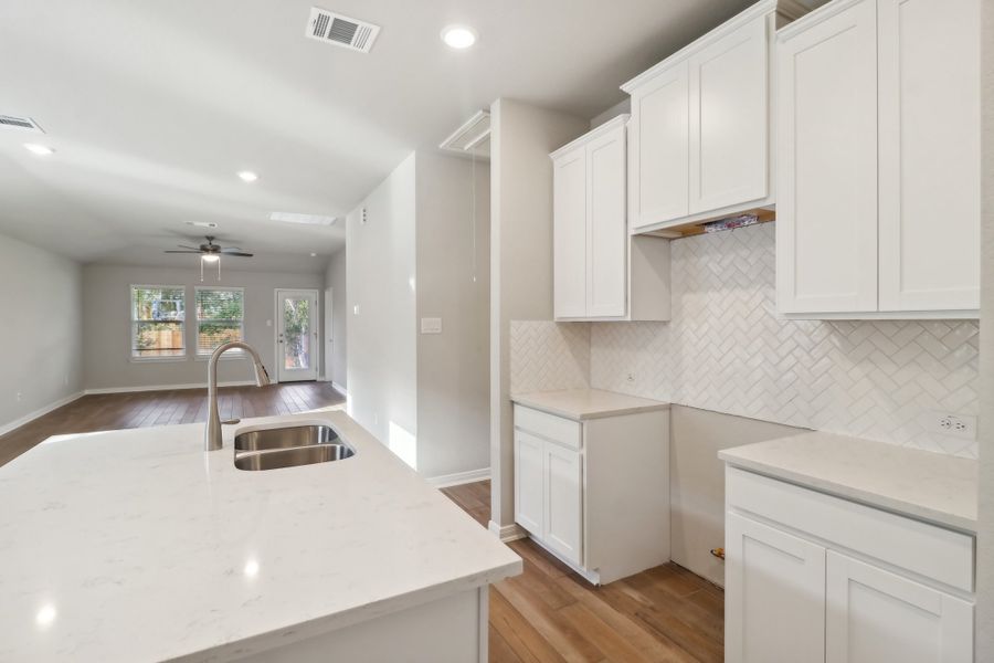 Kitchen in the Cascade floorplan at a Meritage Homes community.