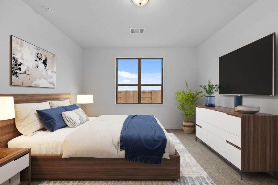 The primary bedroom is a tranquil retreat, layered with soft light and organic textures.