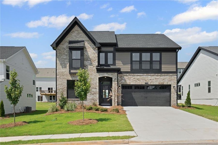 Front exterior of a new home in Twin Lakes, Hoschton, GA, highlighting curb appeal (Image 23).