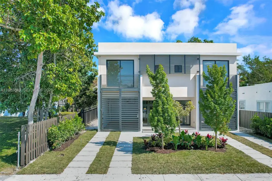 Front exterior of a new home in , Miami, FL, highlighting curb appeal (Image 1). Front exterior of a new home in , Miami, FL, highlighting curb appeal (Image 1).