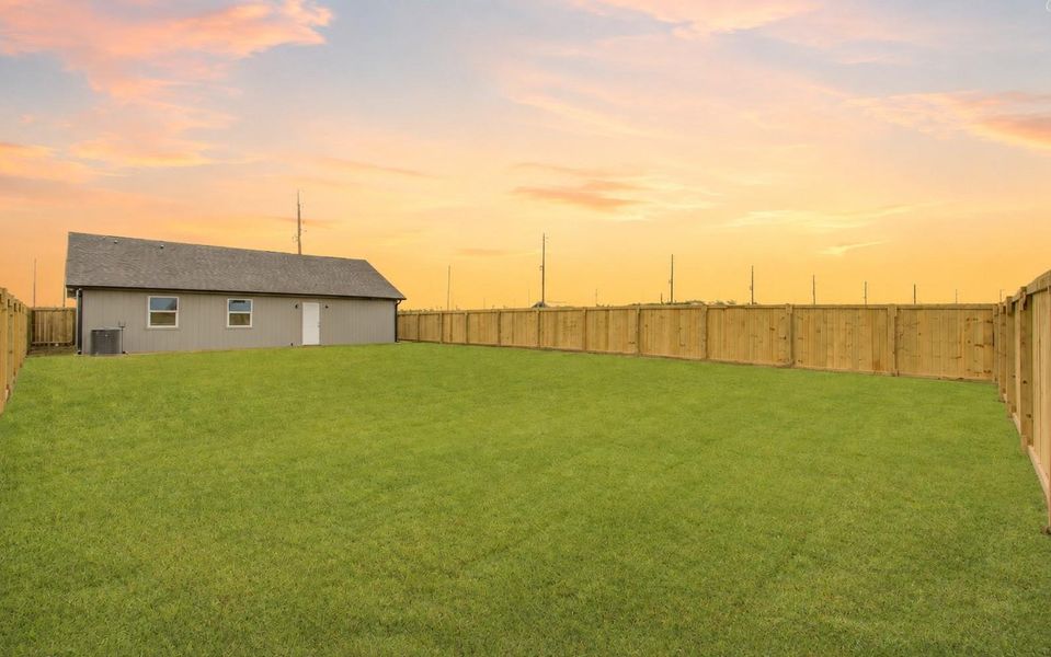 Another view showcasing the impressive size and open layout of the private backyard. (Sky  Virtually Enhanced)
