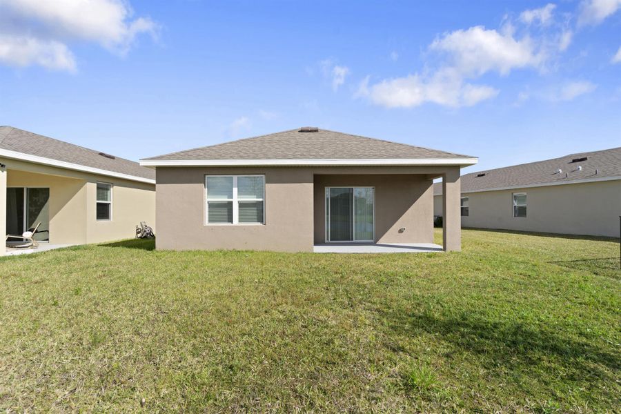 Exterior details and patio area of a home in Central Park 40s, Port St. Lucie (Image 19).