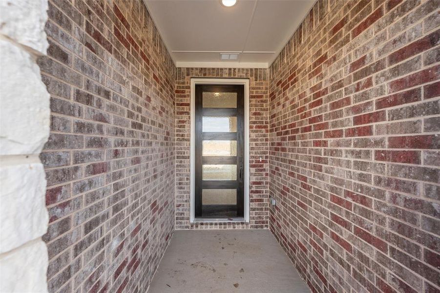 Entrance to property featuring brick siding Entrance to property featuring brick siding