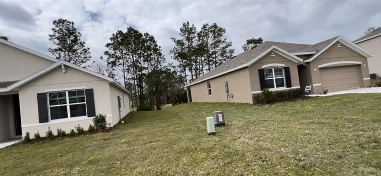 Front exterior of a new home in Lake Diamond, Ocala, FL, highlighting curb appeal (Image 2).