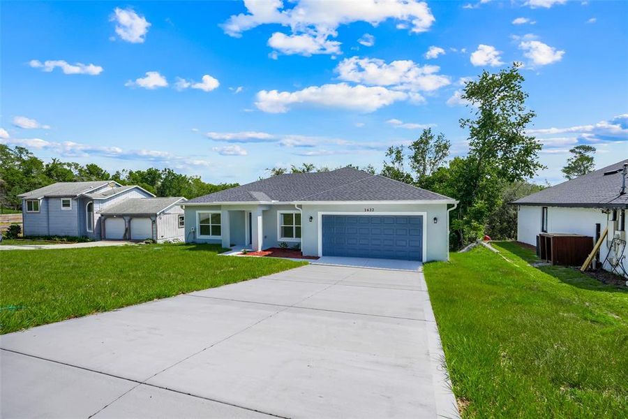Front exterior of a new home in , Deltona, FL, highlighting curb appeal (Image 24).