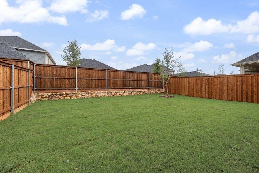 Exterior details and patio area of a home in Spiritas Ranch, Little Elm (Image 21).