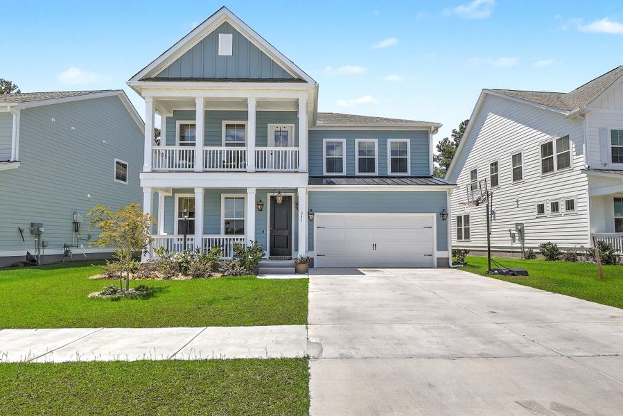 Front exterior of a new home in Tidewater at Lakes of Cane Bay, Summerville, SC, highlighting curb appeal (Image 1). Front exterior of a new home in Tidewater at Lakes of Cane Bay, Summerville, SC, highlighting curb appeal (Image 1).