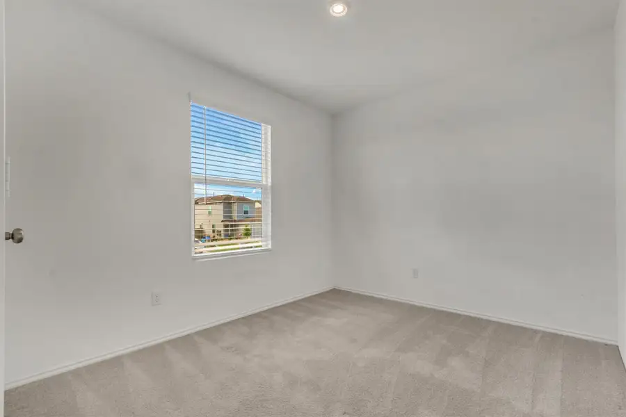 Soft carpet and recessed lighting define this versatile, neutral secondary space. Soft carpet and recessed lighting define this versatile, neutral secondary space.