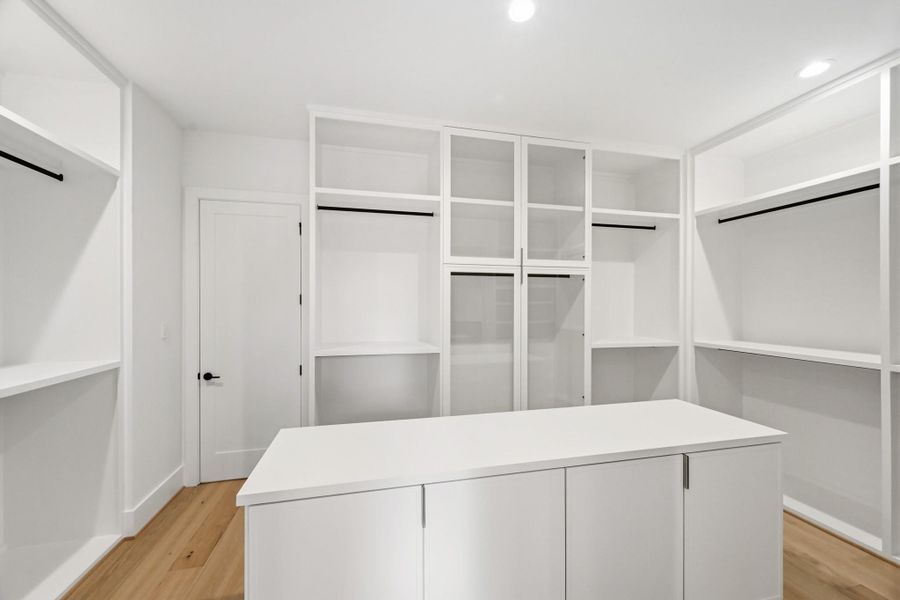 The incredible master closet offers direct access to the utility room!