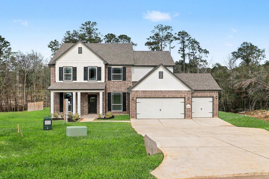 Front exterior of a new home in Oakwood Ranch, Willis, TX, highlighting curb appeal (Image 21).
