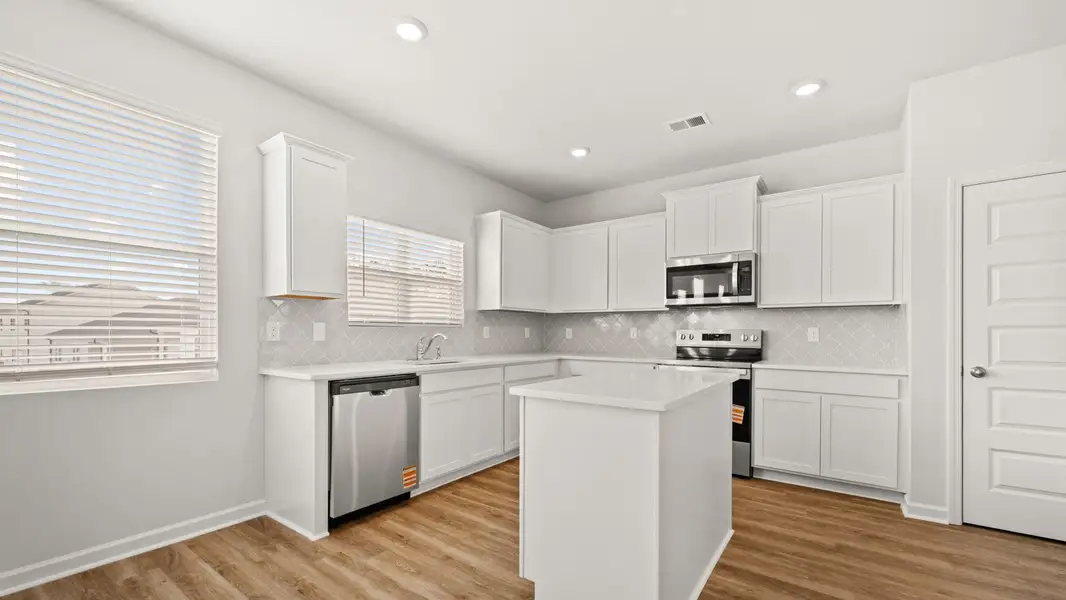 Representative furnished interior of a home built from the Packard by D.R. Horton in Oakchase at Hampton, Hampton (Image 6).