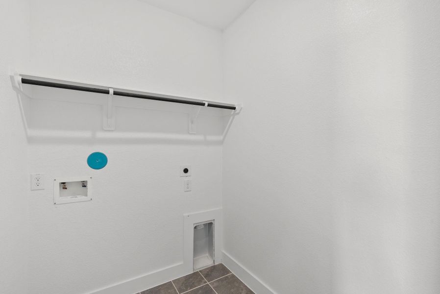 Whether you're sorting through the week’s clothes or prepping for a family gathering, this laundry room is designed to be a cheerful and functional part of your home, where every wash feels like a fresh start.