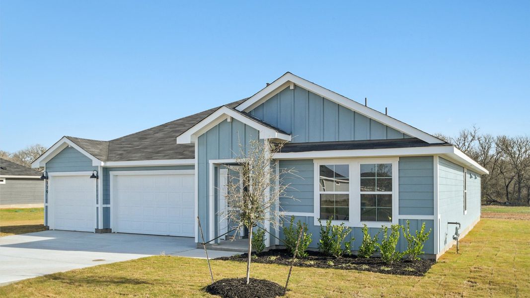 Front exterior of a new home in Railhead, Cedar Creek, TX, highlighting curb appeal (Image 16).