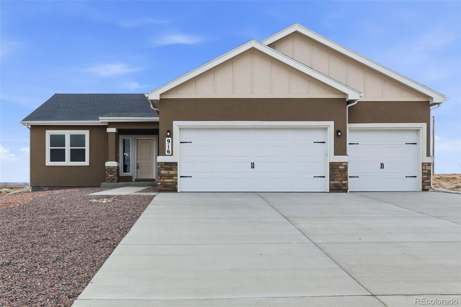 Front exterior of a new home in , Pueblo West, CO, highlighting curb appeal (Image 1). Front exterior of a new home in , Pueblo West, CO, highlighting curb appeal (Image 1).