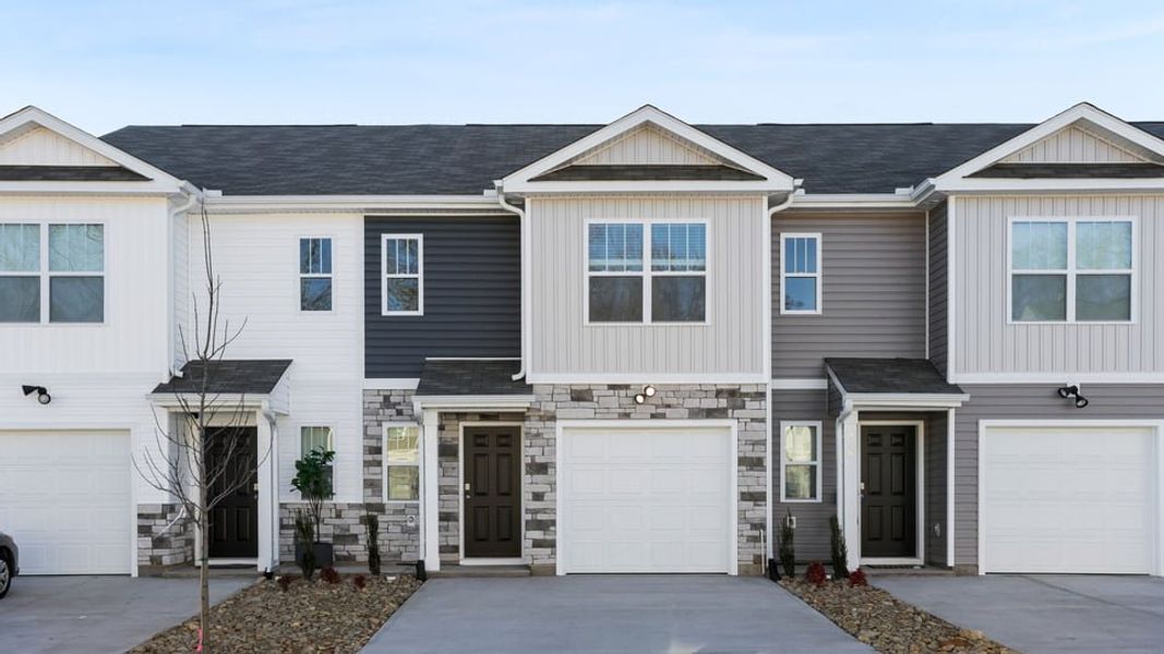 Front exterior of a new home in Chestnut Ridge Townhomes, Greenville, SC, highlighting curb appeal (Image 1). Front exterior of a new home in Chestnut Ridge Townhomes, Greenville, SC, highlighting curb appeal (Image 1).