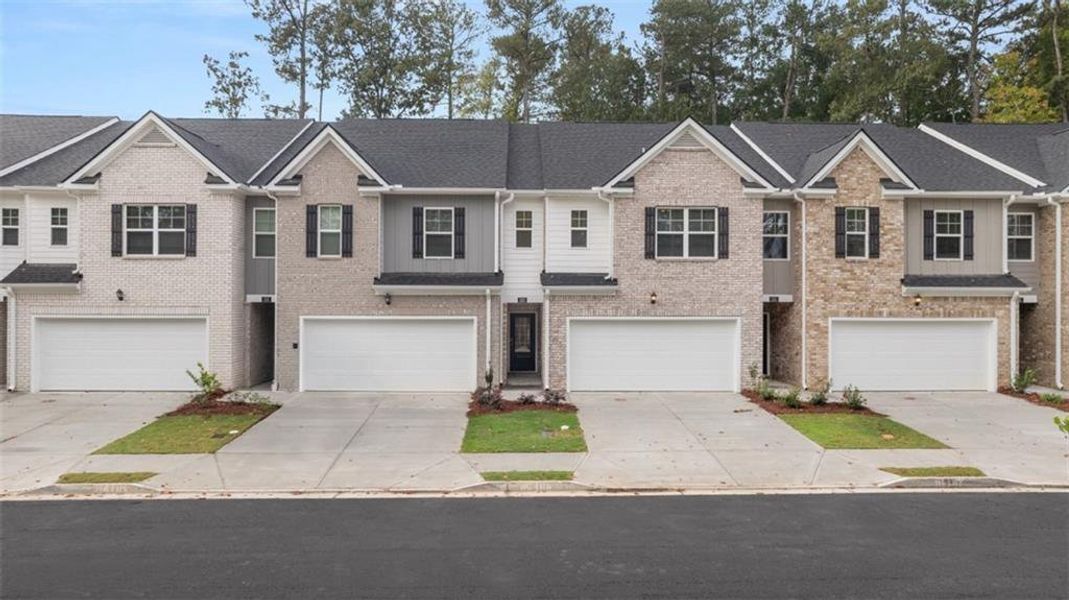 Front exterior of a new home in , Loganville, GA, highlighting curb appeal (Image 2). Front exterior of a new home in , Loganville, GA, highlighting curb appeal (Image 2).