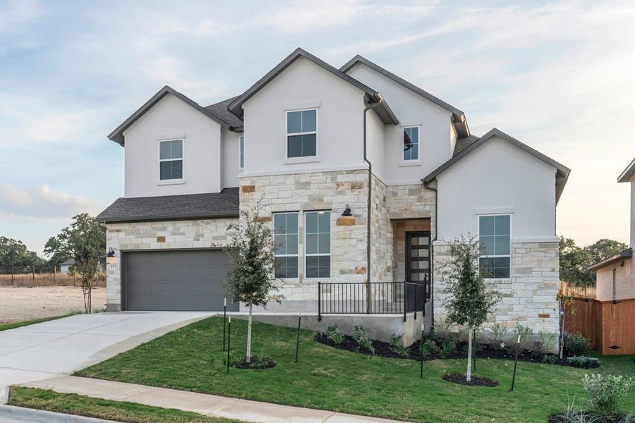 Front exterior of a new home in Capitol Collection at Lariat, Liberty Hill, TX, highlighting curb appeal (Image 2).