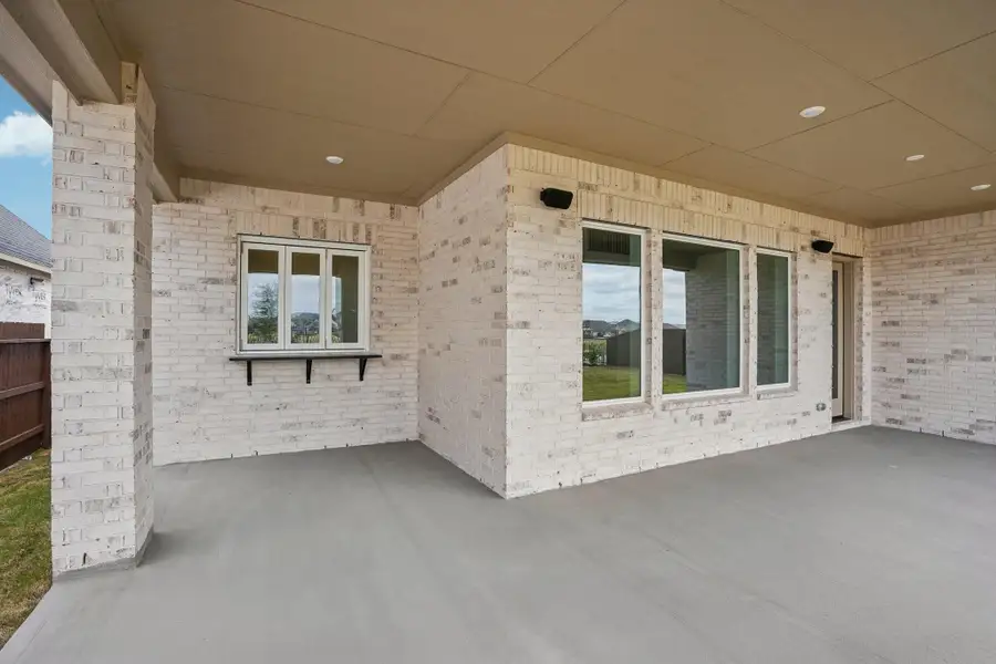 Exterior details and patio area of a home in Del Bello Lakes 60', Manvel (Image 3).