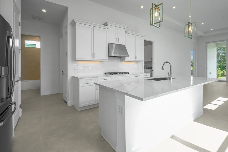 Furnished interior view inside a new home in Rivella, Port St. Lucie (Image 7).