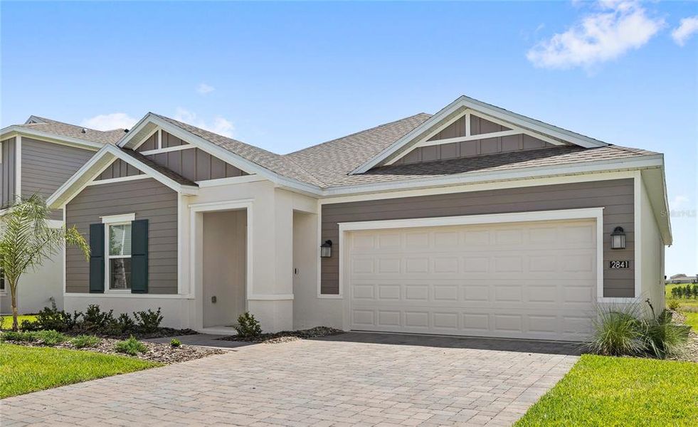 Front exterior of a new home in Wellness Ridge, Clermont, FL, highlighting curb appeal (Image 20). Front exterior of a new home in Wellness Ridge, Clermont, FL, highlighting curb appeal (Image 20).