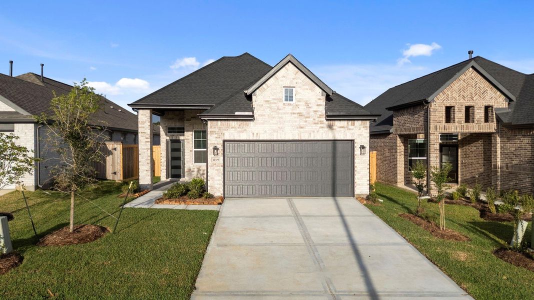 Front exterior of a new home in Emory Glen, Magnolia, TX, highlighting curb appeal (Image 18).