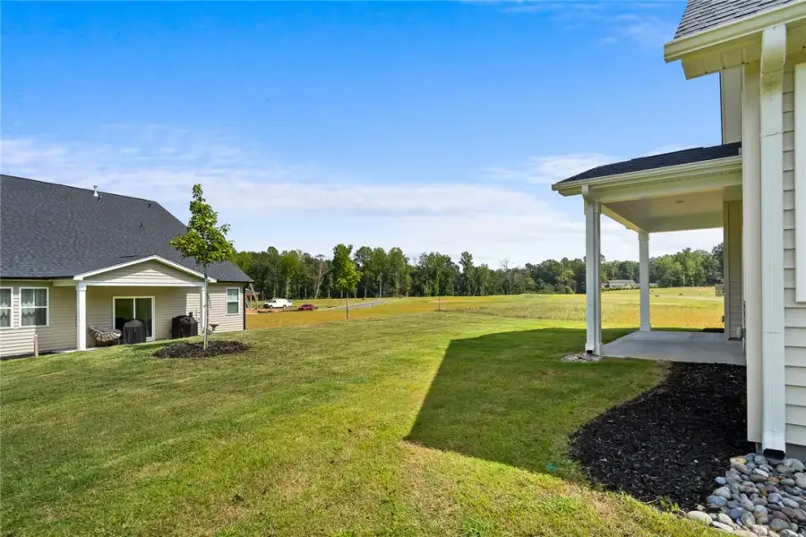 A spacious green lawn stretches out from the cover A spacious green lawn stretches out from the cover