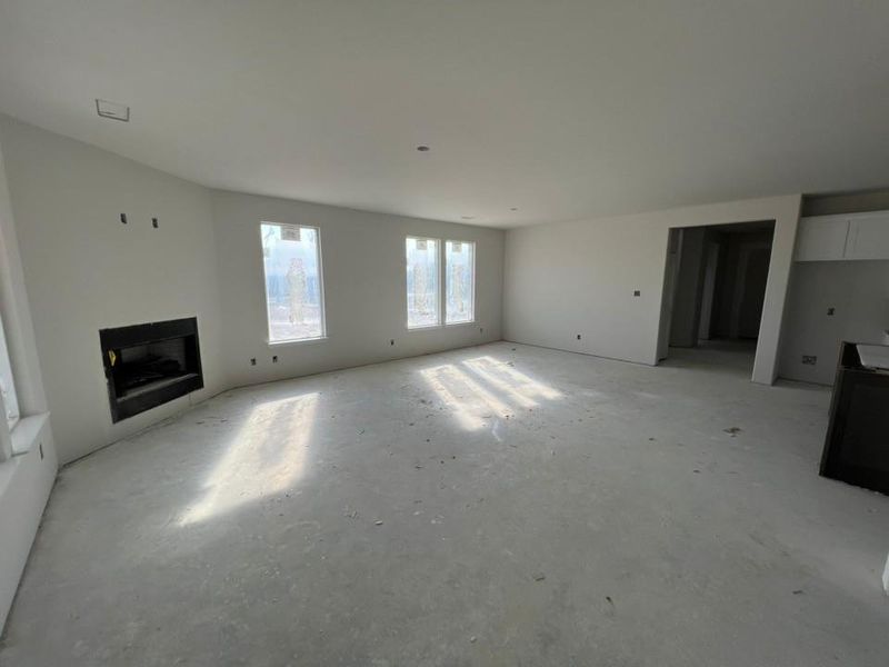 Unfurnished living room featuring a fireplace