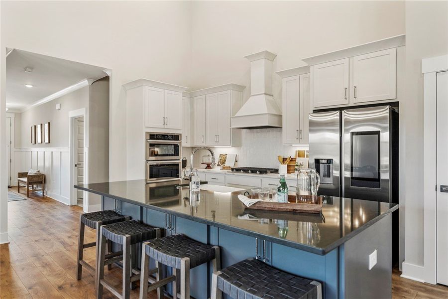 This spacious kitchen offers a large island with s